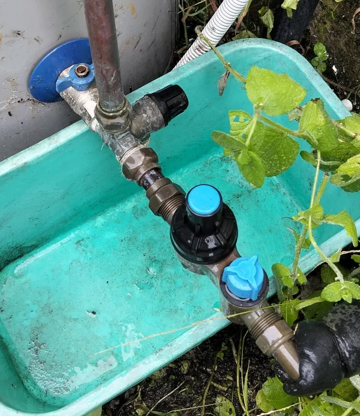 Hot-water cylinder valve assembly and connected pipework photographed during the Moera attendance