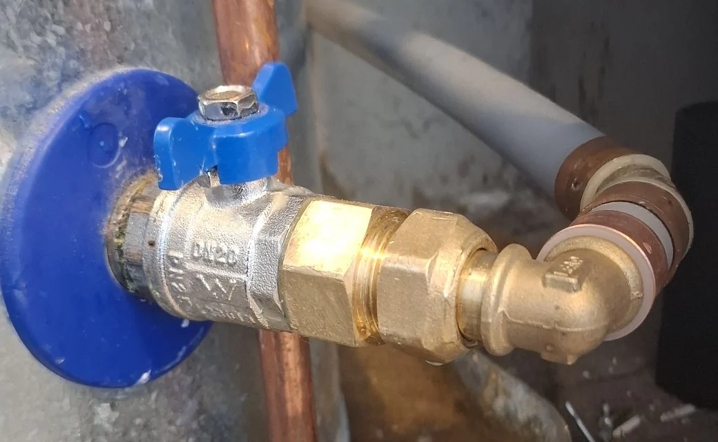 Replacement brass fitting and swivel elbow connected to the hot-water cylinder in Petone